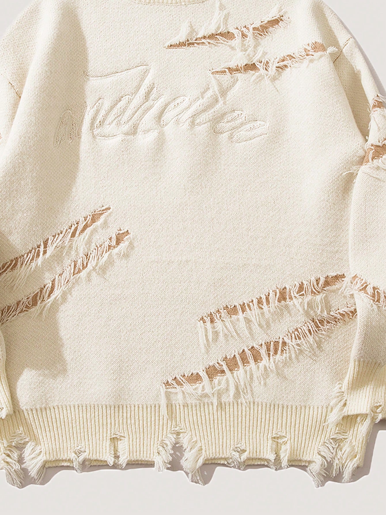 ANDREILEE EMBROIDERED LETTERS, TORN HOLES, TASSEL SWEATER