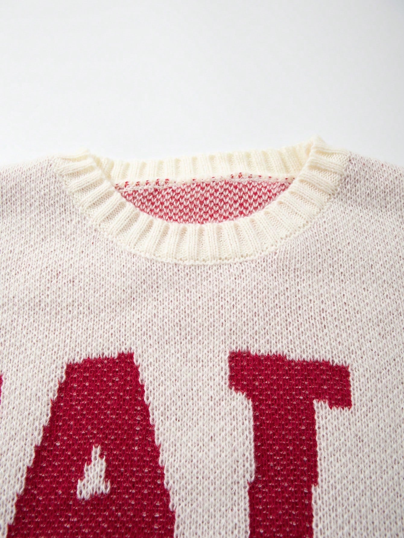 ANDREILEE LETTER-PATTERNED DISTRESSED SWEATER