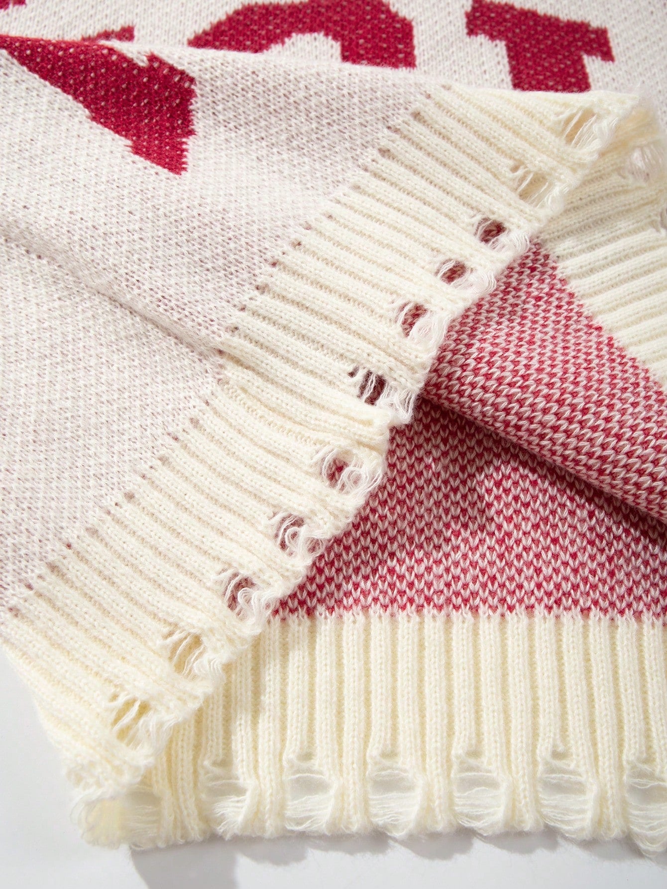 ANDREILEE LETTER-PATTERNED DISTRESSED SWEATER